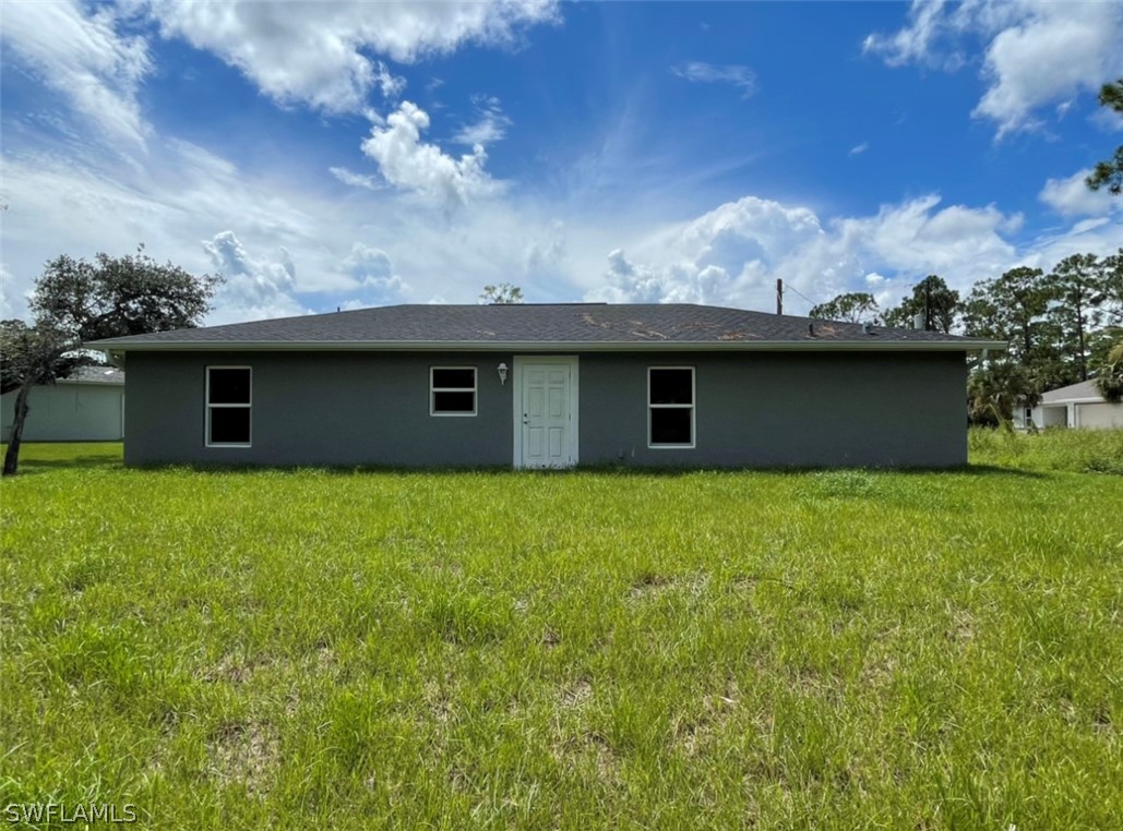 5010 Sun Court LaBelle, FL 33935 - Photo 3 of 20 a view of a house with a garden