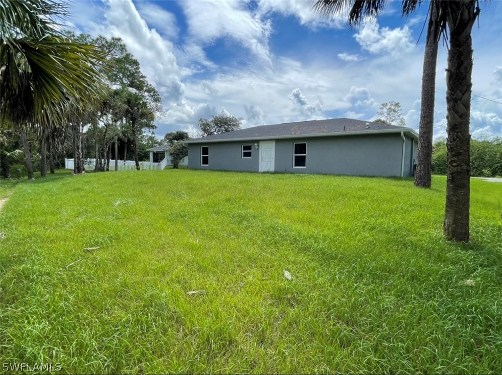 5010 Sun Court LaBelle, FL 33935 - Photo 4 of 20 a view of a house with a backyard