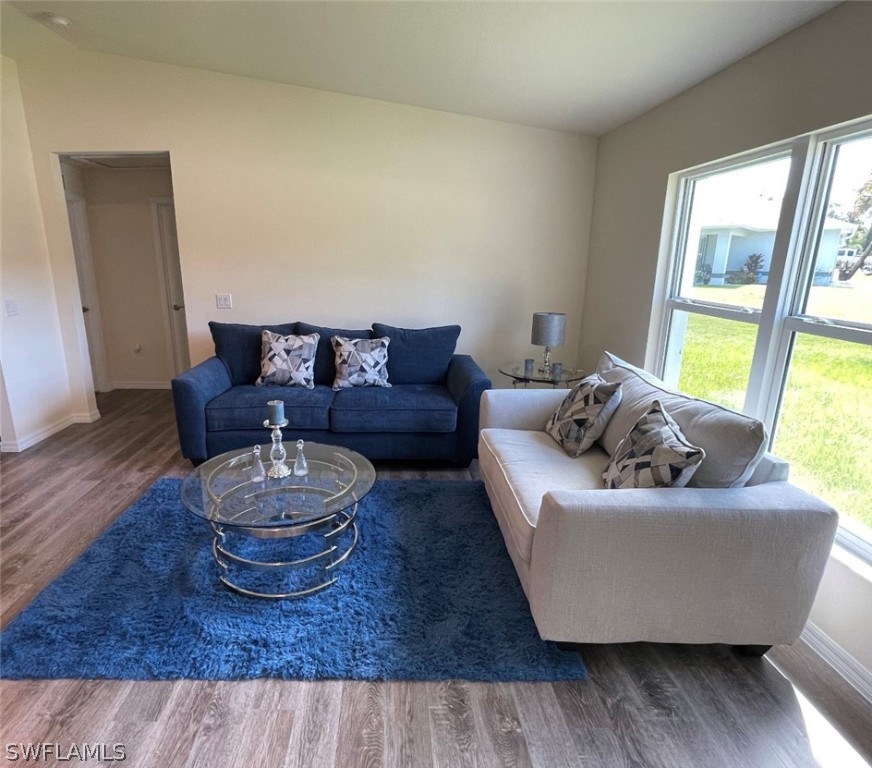 5010 Sun Court LaBelle, FL 33935 - Photo 6 of 20 a living room with furniture and a large window