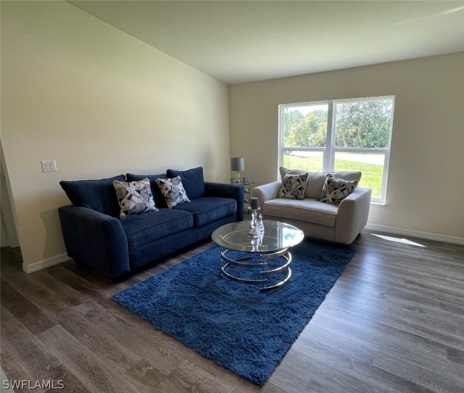 5010 Sun Court LaBelle, FL 33935 - Photo 7 of 20 a living room with furniture and a large window