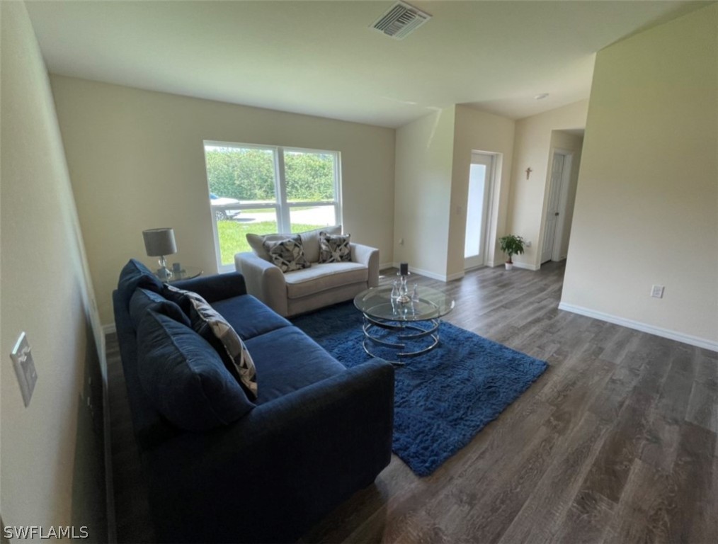 5010 Sun Court LaBelle, FL 33935 - Photo 8 of 20 a living room with furniture and a large window