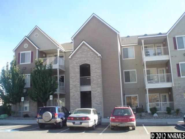 a view of street with parked cars