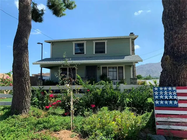 a front view of a house with a porch