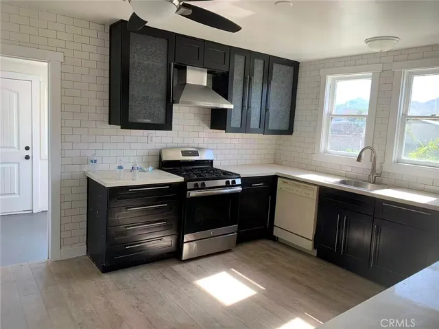 a kitchen with a sink and a stove