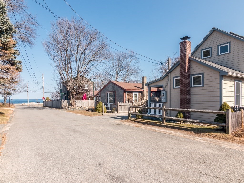 5 White Way Rockport, MA 01966 - Photo 5 of 41 a front view of a house with a yard