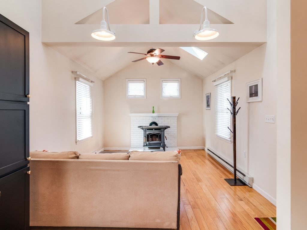 5 White Way Rockport, MA 01966 - Photo 8 of 41 a living room with stainless steel appliances kitchen island granite countertop furniture and a chandelier