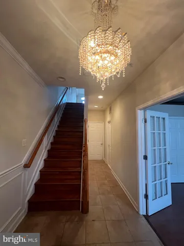 a living room with fireplace furniture and a wooden floor