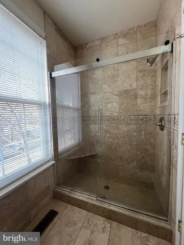 a kitchen with a table and chairs in it