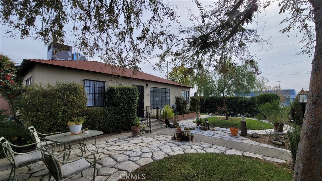 2701 Berkeley Street Bakersfield, CA 93305 - Photo 11 of 58 a view of a chair and table in backyard of the house