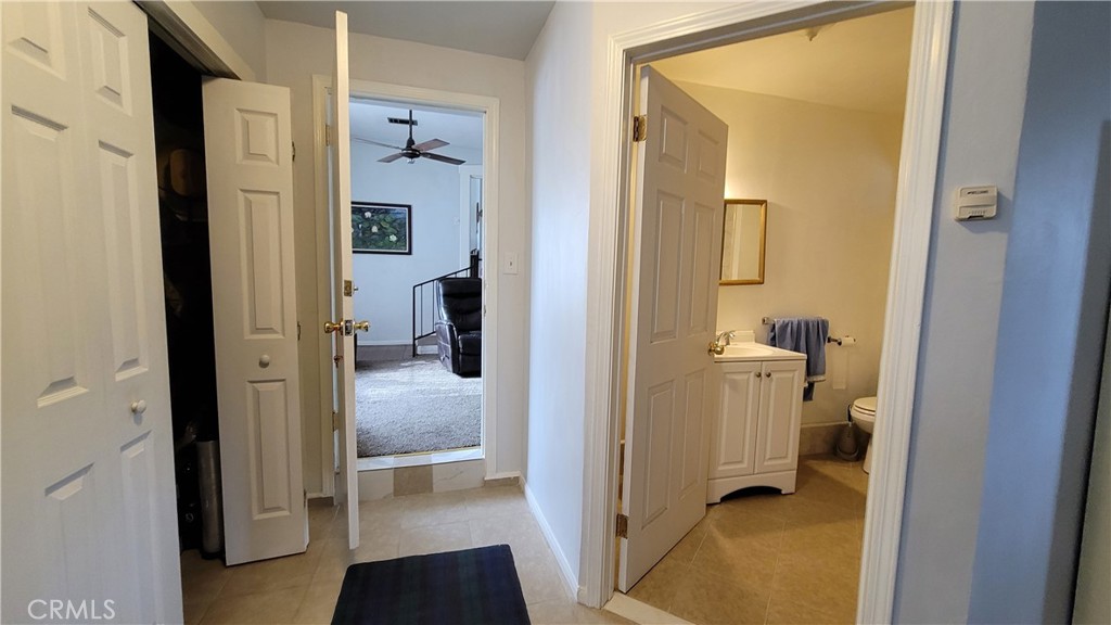 2701 Berkeley Street Bakersfield, CA 93305 - Photo 13 of 58 a view of a bathroom from a hallway