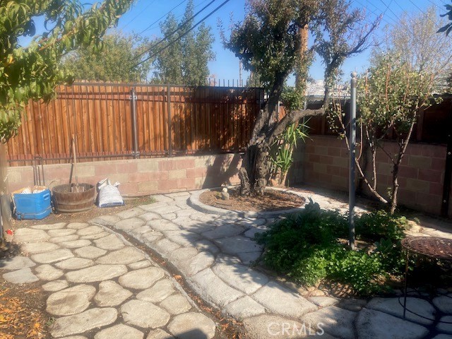 2701 Berkeley Street Bakersfield, CA 93305 - Photo 18 of 58 a view of a backyard with plants and a bench
