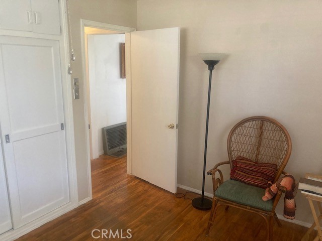 2701 Berkeley Street Bakersfield, CA 93305 - Photo 34 of 58 a view of a hallway with entryway wooden floor and front door