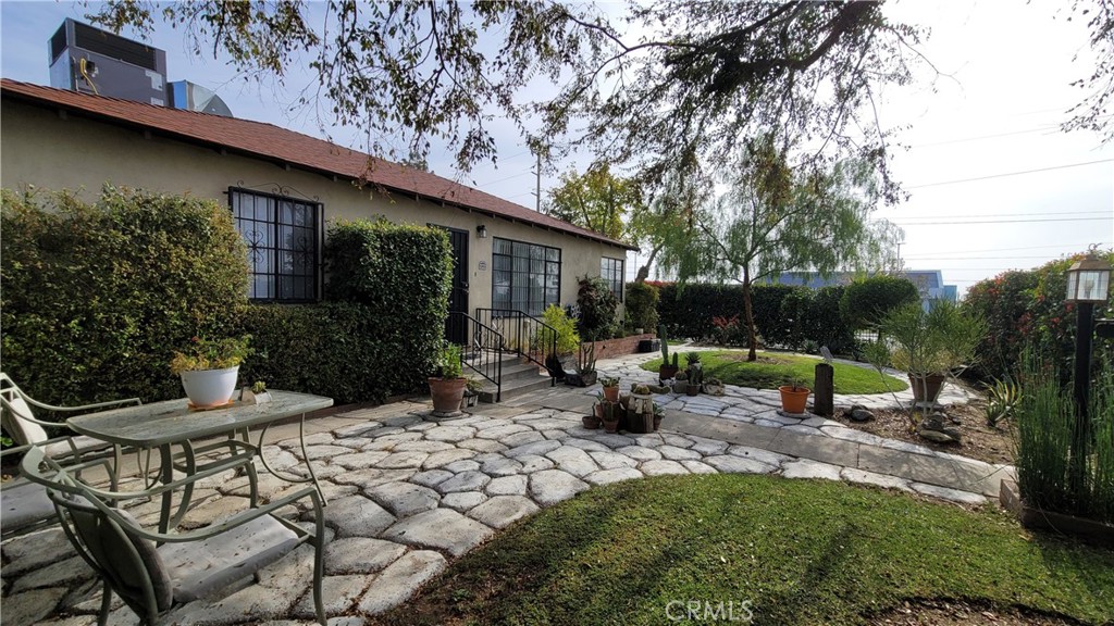 2701 Berkeley Street Bakersfield, CA 93305 - Photo 47 of 58 a view of a chair and table in backyard of the house