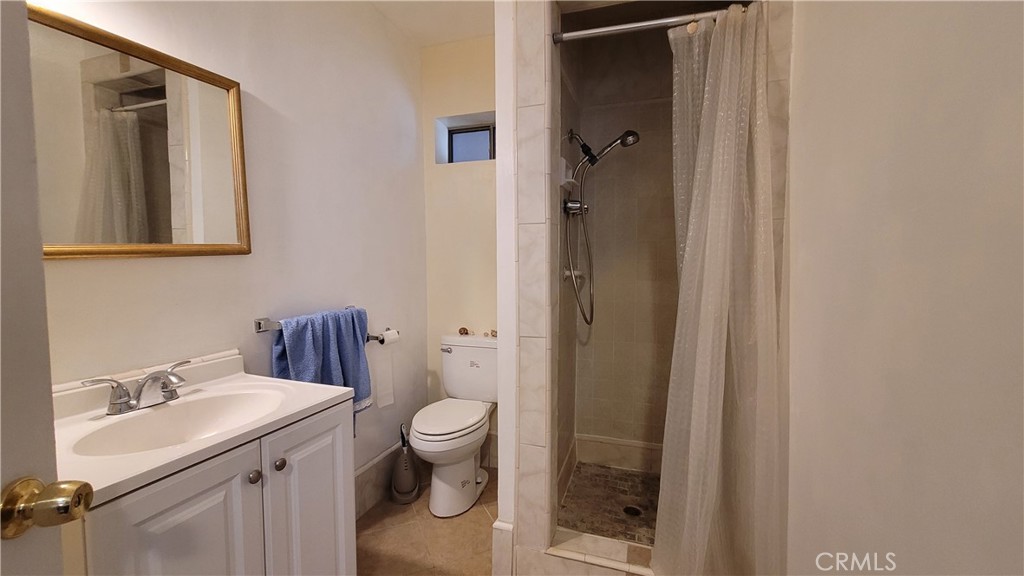 2701 Berkeley Street Bakersfield, CA 93305 - Photo 51 of 58 a bathroom with a sink and a toilet