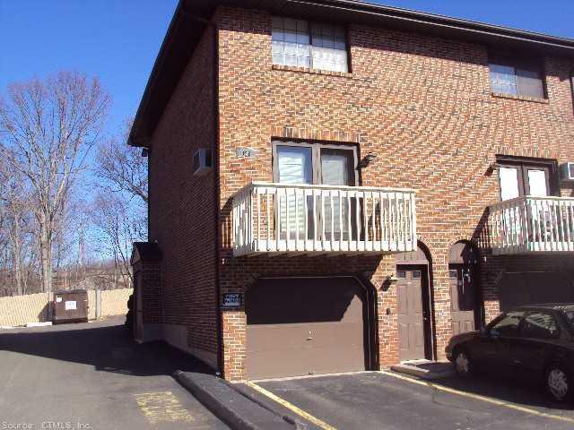329 Scott Road, Unit B11 Waterbury, CT 06705 - Photo 1 of 1 a front view of a house with a yard