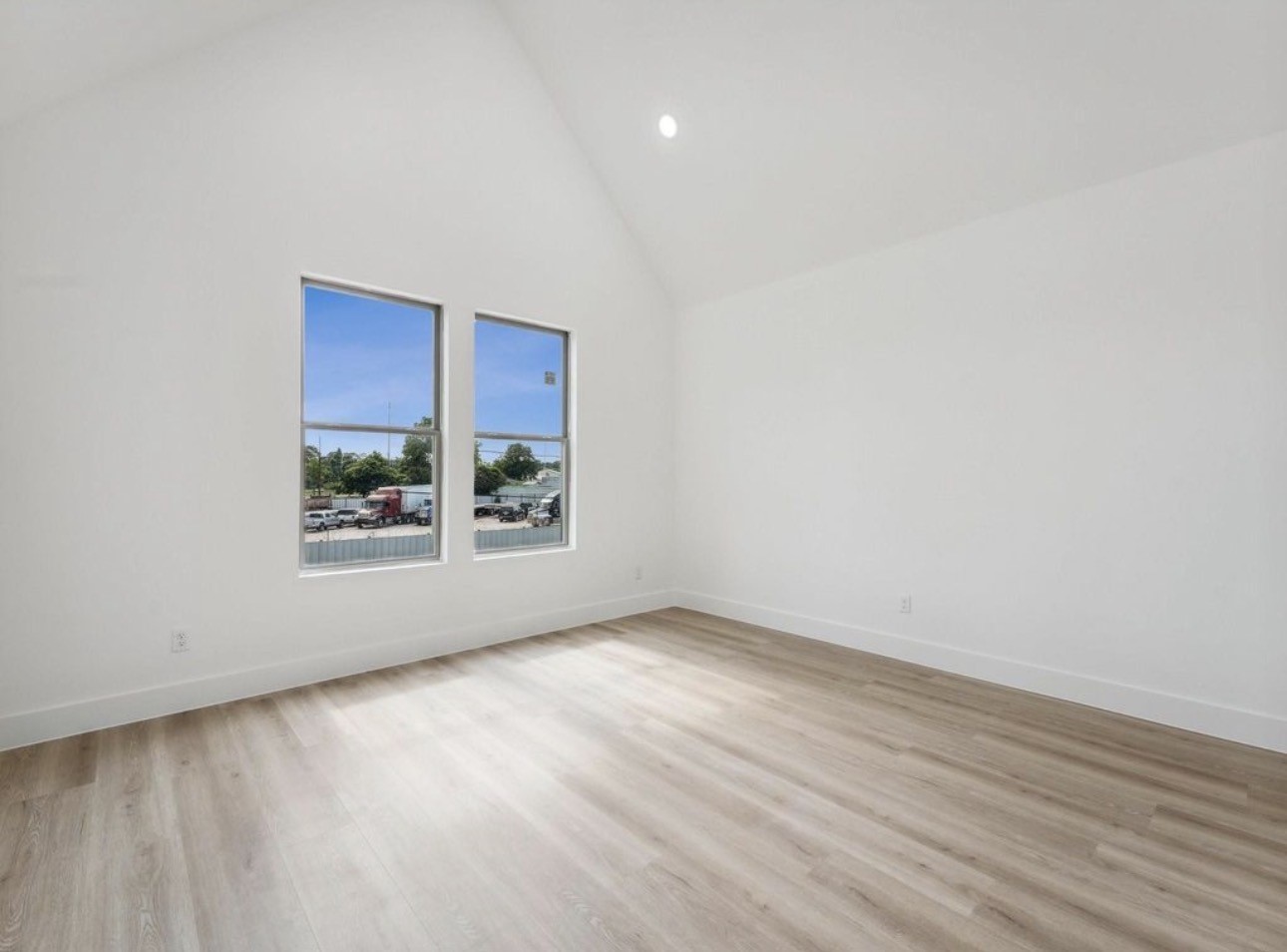 7416 Maxroy Street Houston, TX 77088 - Photo 15 of 35 a view of an empty room with wooden floor and a window