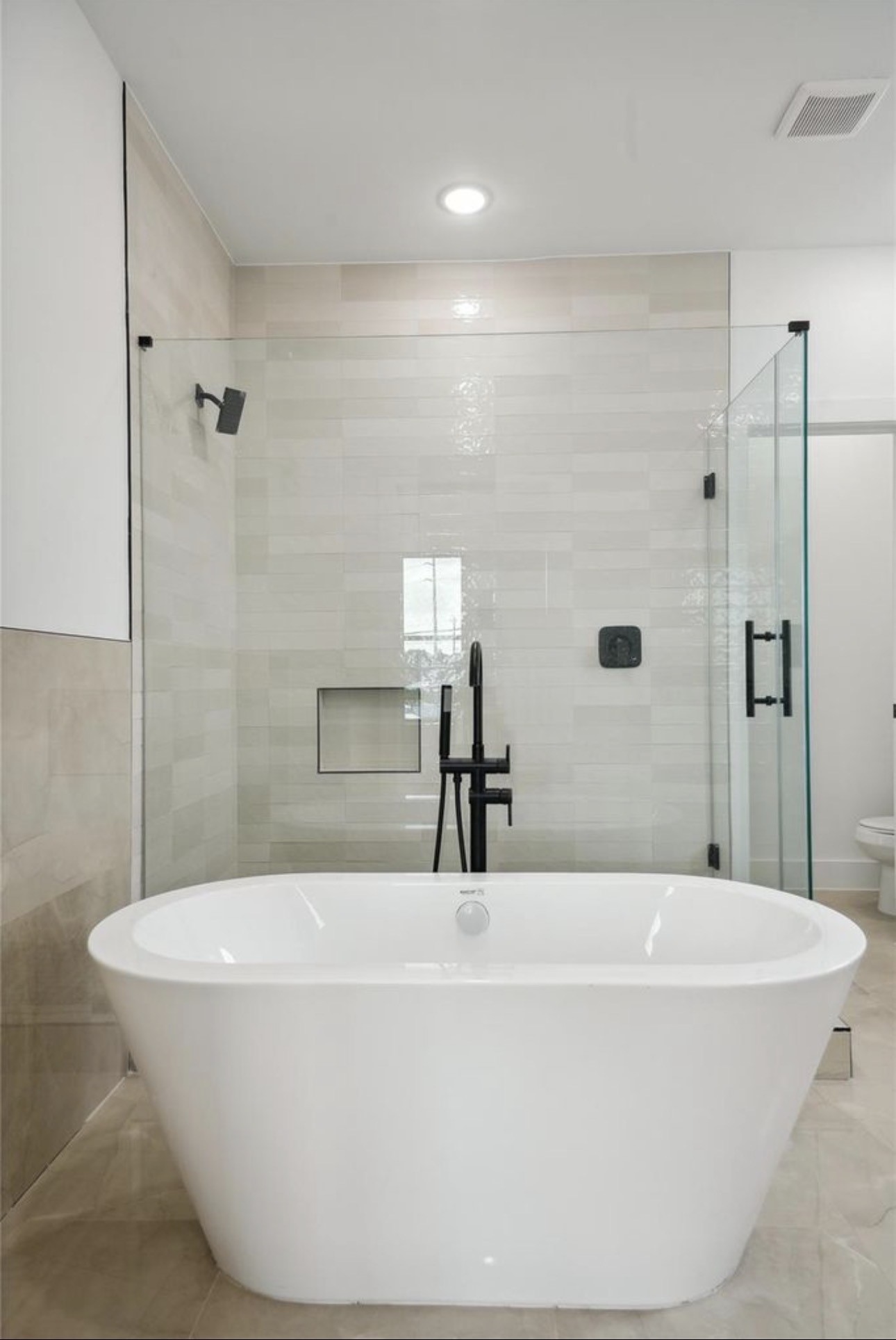 7416 Maxroy Street Houston, TX 77088 - Photo 19 of 35 a bathroom with a bathtub and shower
