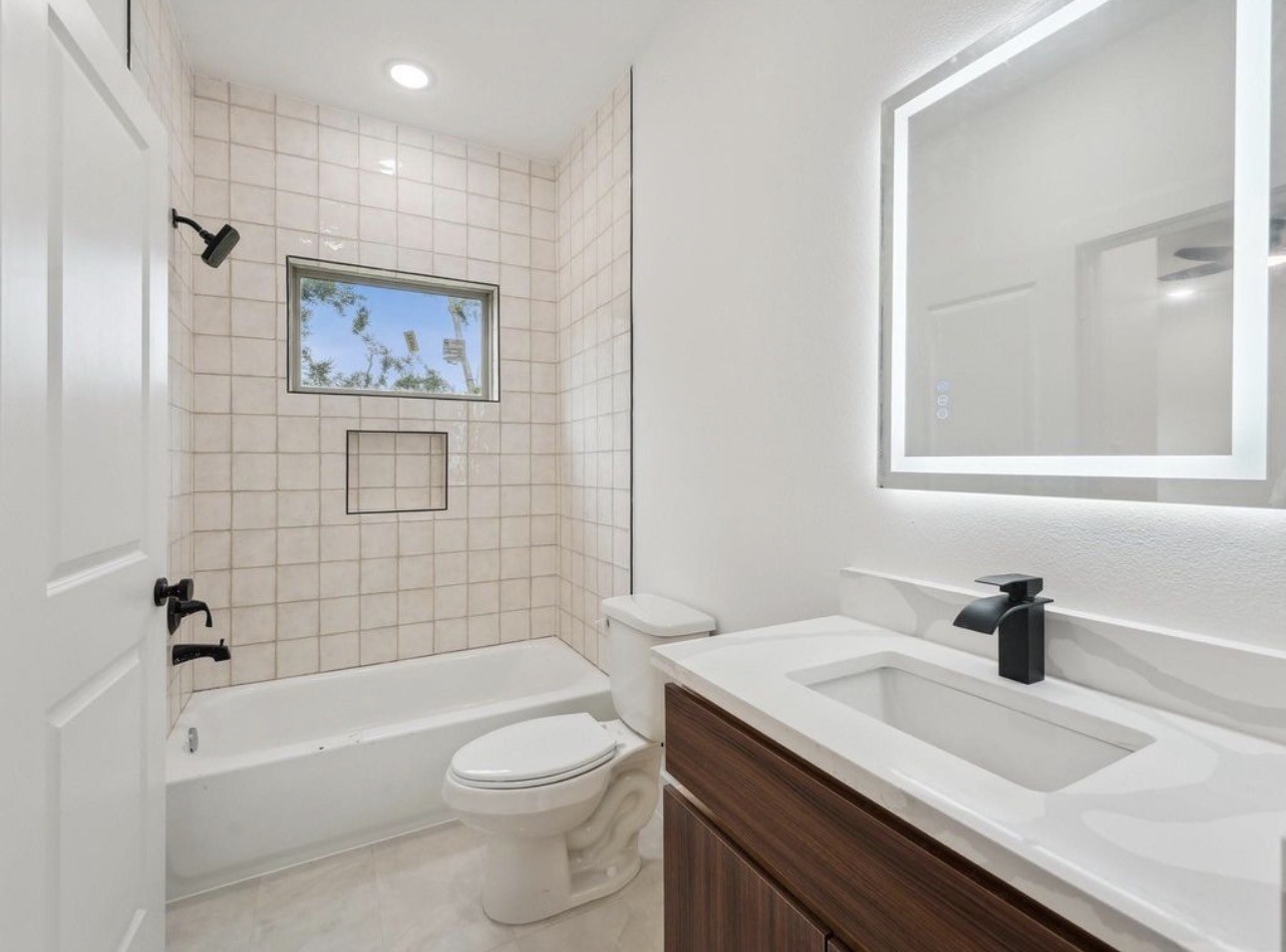 7416 Maxroy Street Houston, TX 77088 - Photo 28 of 35 a bathroom with a sink a toilet and shower