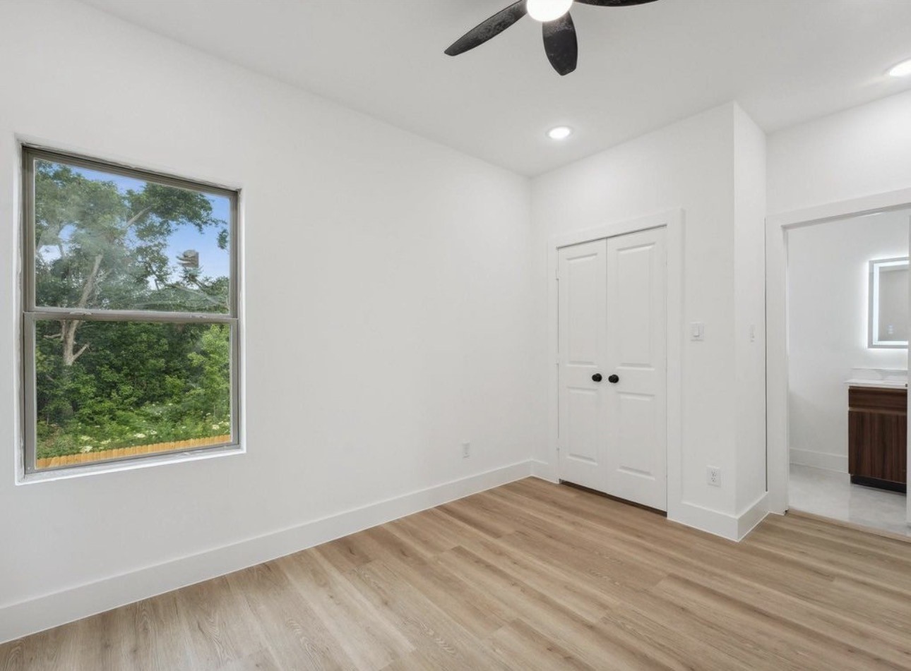 7416 Maxroy Street Houston, TX 77088 - Photo 31 of 35 wooden floor in an empty room with a window