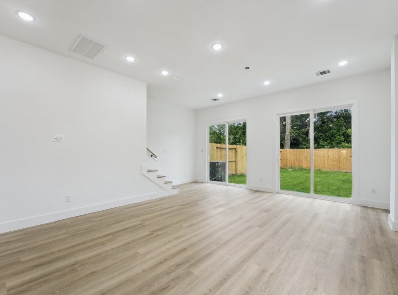 7416 Maxroy Street Houston, TX 77088 - Photo 6 of 35 a view of empty room with windows