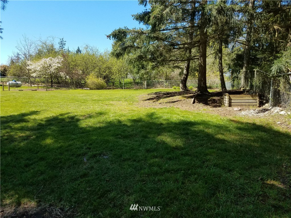 0 Lancaster Road Freeland, WA 98249 - Photo 2 of 11 a view of a park with large trees