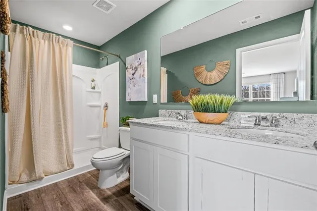 a living room with a sink and a mirror