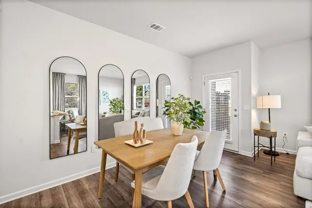 a view of a dining room with furniture window and wooden floor
