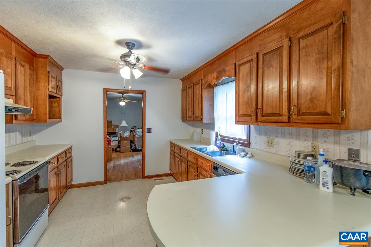 11 Meadow Ridge Road Waynesboro, VA 22980 - Photo 17 of 17 a kitchen with stainless steel appliances granite countertop a sink dishwasher stove and refrigerator with wooden floor
