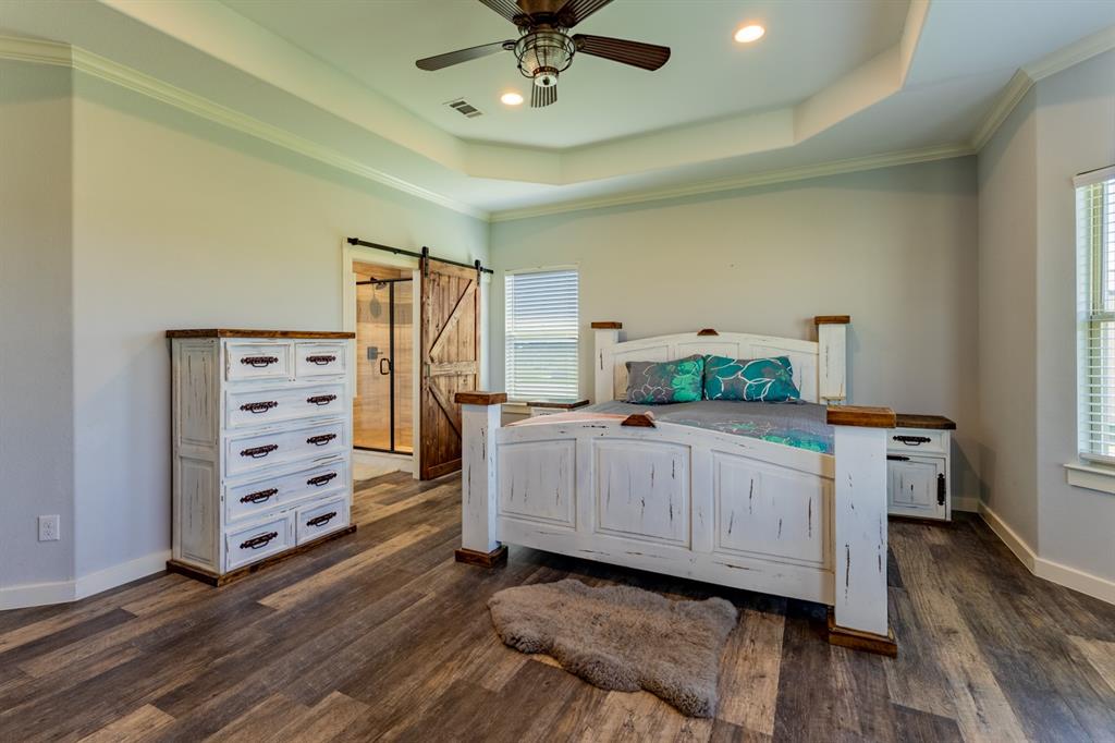 14910 Old Stoney Road Ponder, TX 76259 - Photo 18 of 36 a bedroom with a bed and a dresser
