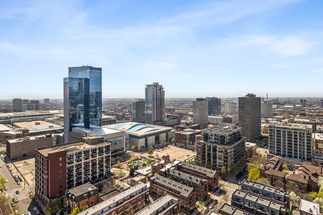 a kitchen with granite countertop stainless steel appliances a refrigerator a stove a sink and a counter space
