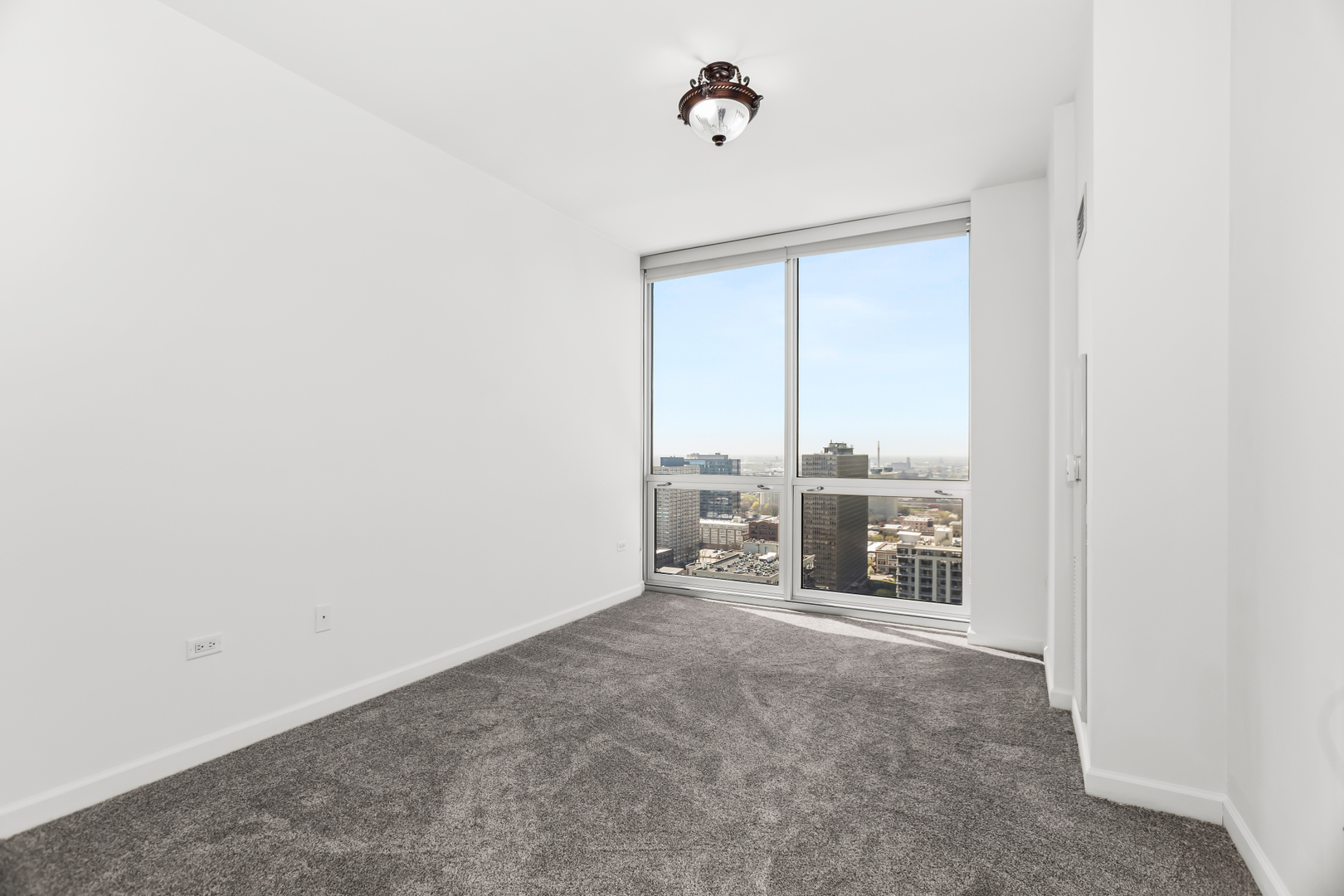 1901 South Calumet Avenue, Unit 2712 Chicago, IL 60616 - Photo 19 of 39 a view of a livingroom with a flat screen tv