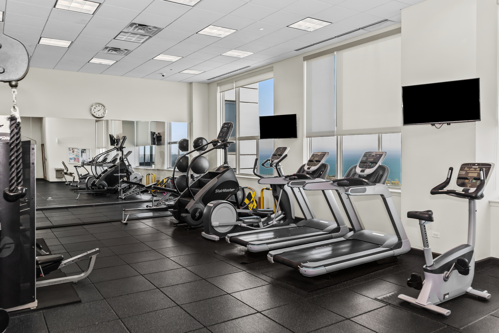 1901 South Calumet Avenue, Unit 2712 Chicago, IL 60616 - Photo 26 of 39 a room with gym equipment and a flat screen tv
