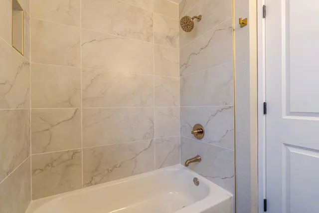 a view of backyard with wooden fence and large trees