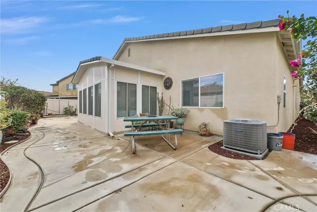 a view of a patio with chair and tables