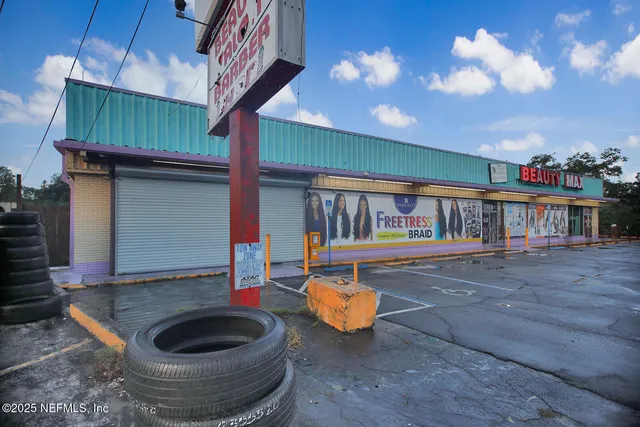 a living room with furniture a rug and a chandelier
