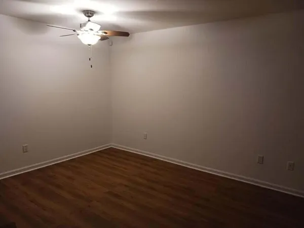 a view of a small space with wooden floor