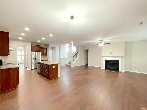 a view of kitchen and hall with wooden floor