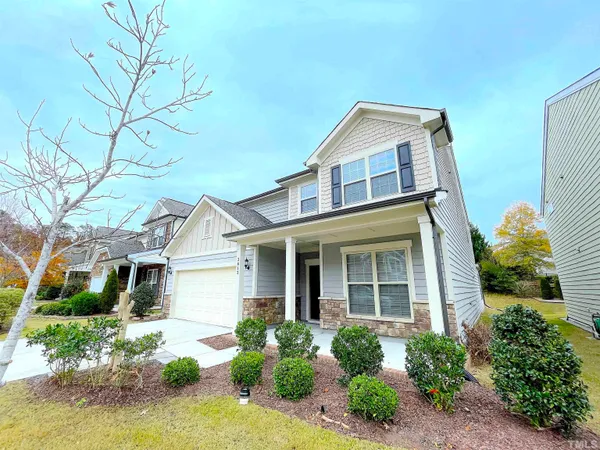 front view of a house with a yard