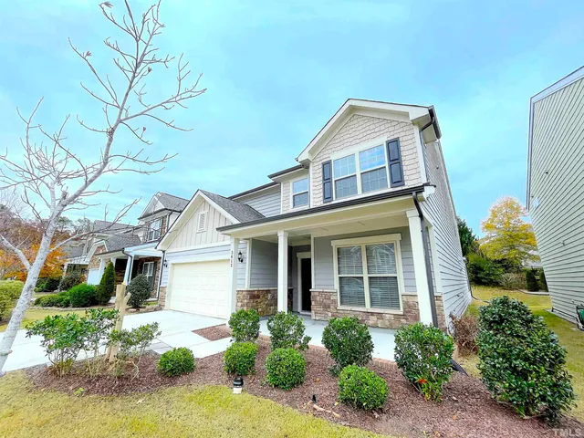 front view of a house with a yard