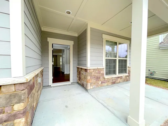 a view of a livingroom with wooden floor
