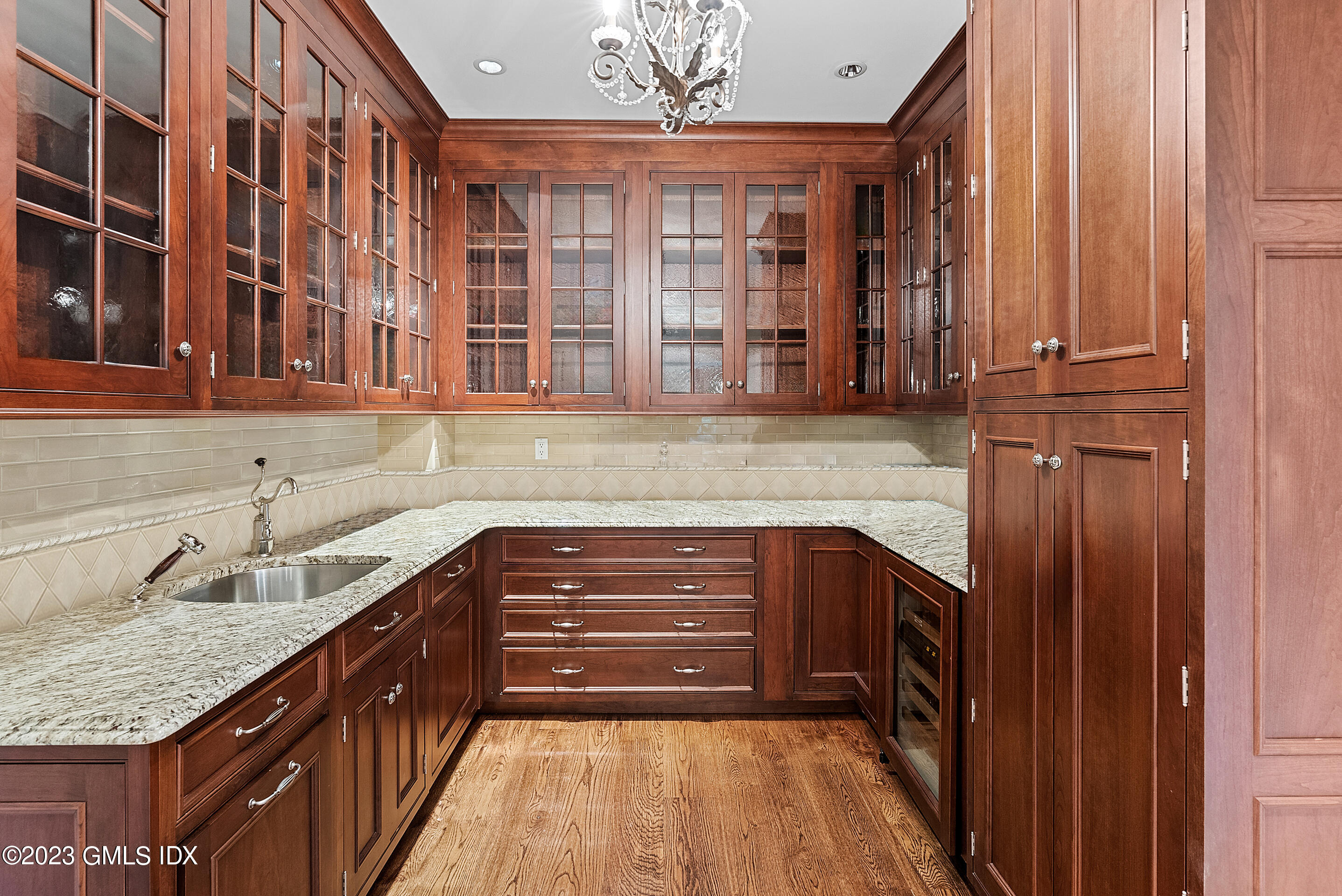 151 Clapboard Ridge Road Greenwich, CT 06831 - Photo 11 of 34 a kitchen with a sink and cabinets