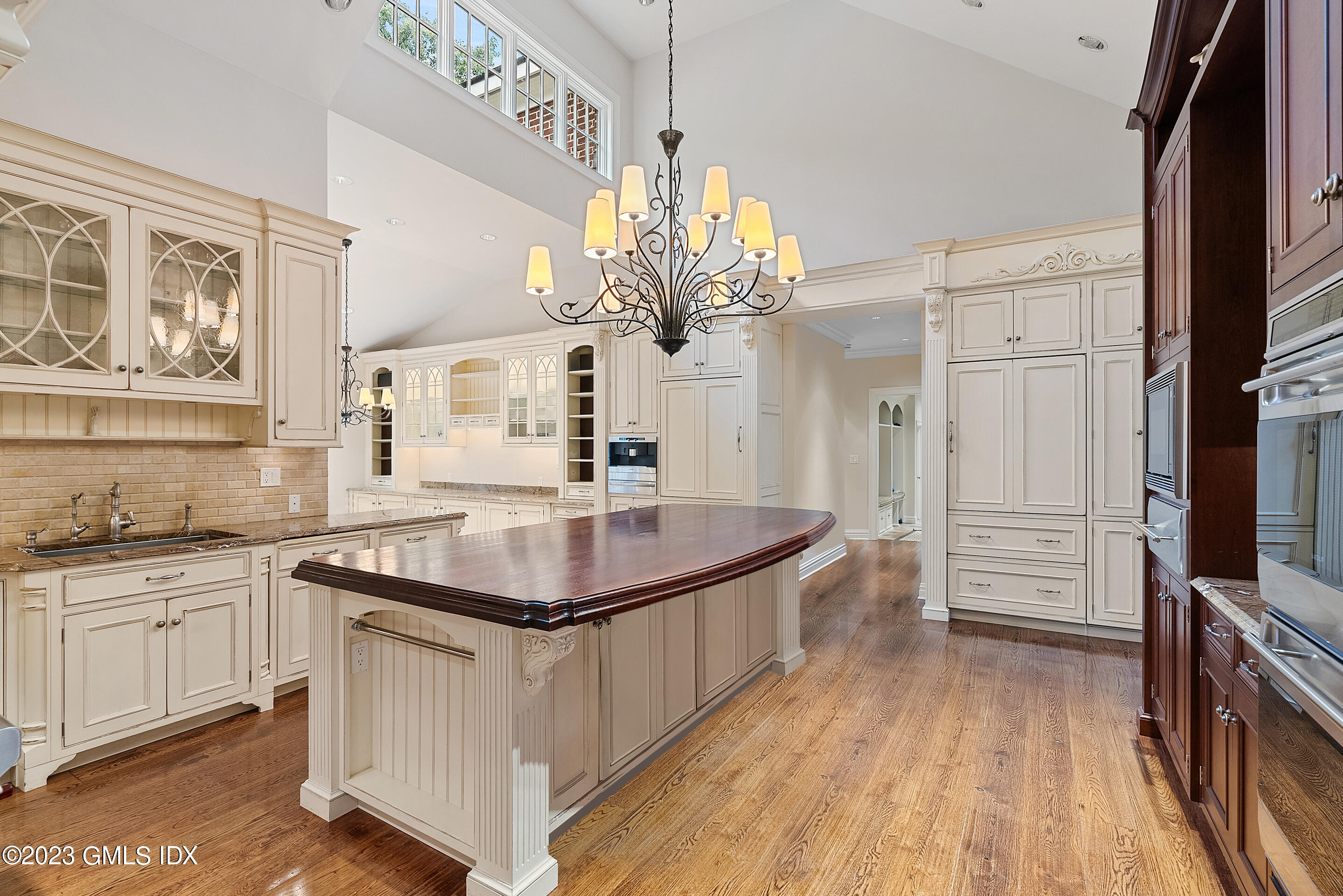 151 Clapboard Ridge Road Greenwich, CT 06831 - Photo 12 of 34 a kitchen with stainless steel appliances granite countertop a sink stove and refrigerator