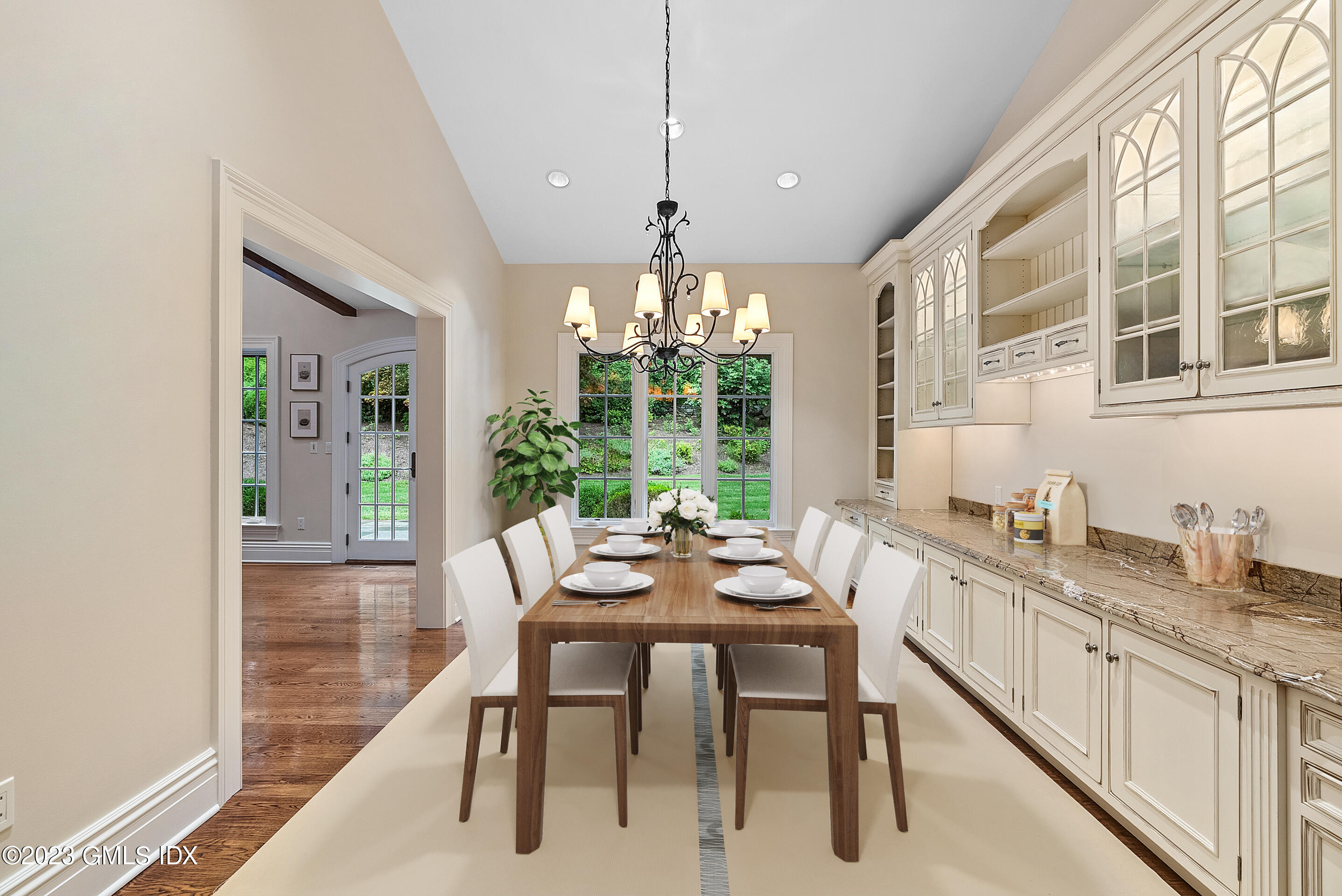 151 Clapboard Ridge Road Greenwich, CT 06831 - Photo 13 of 34 a dining room with furniture a chandelier and wooden floor