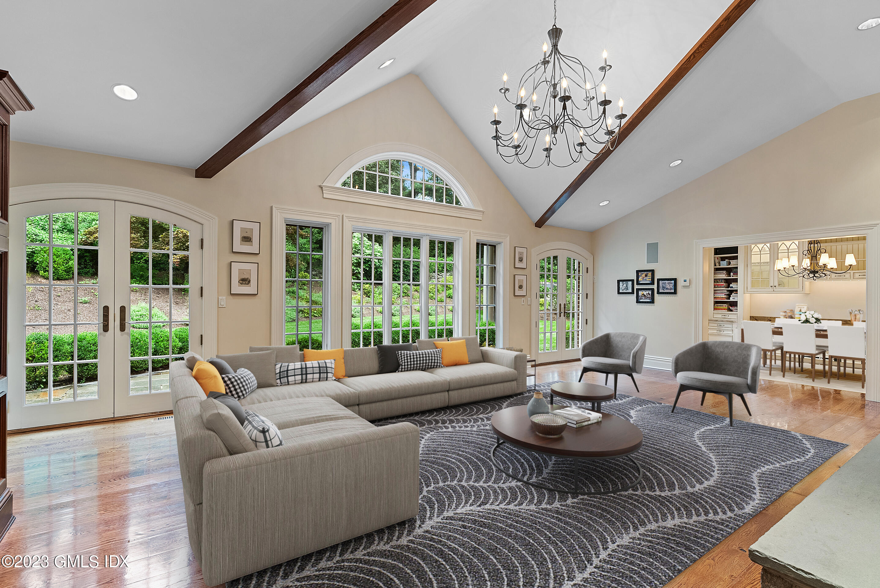 151 Clapboard Ridge Road Greenwich, CT 06831 - Photo 14 of 34 a living room with furniture chandelier and large windows