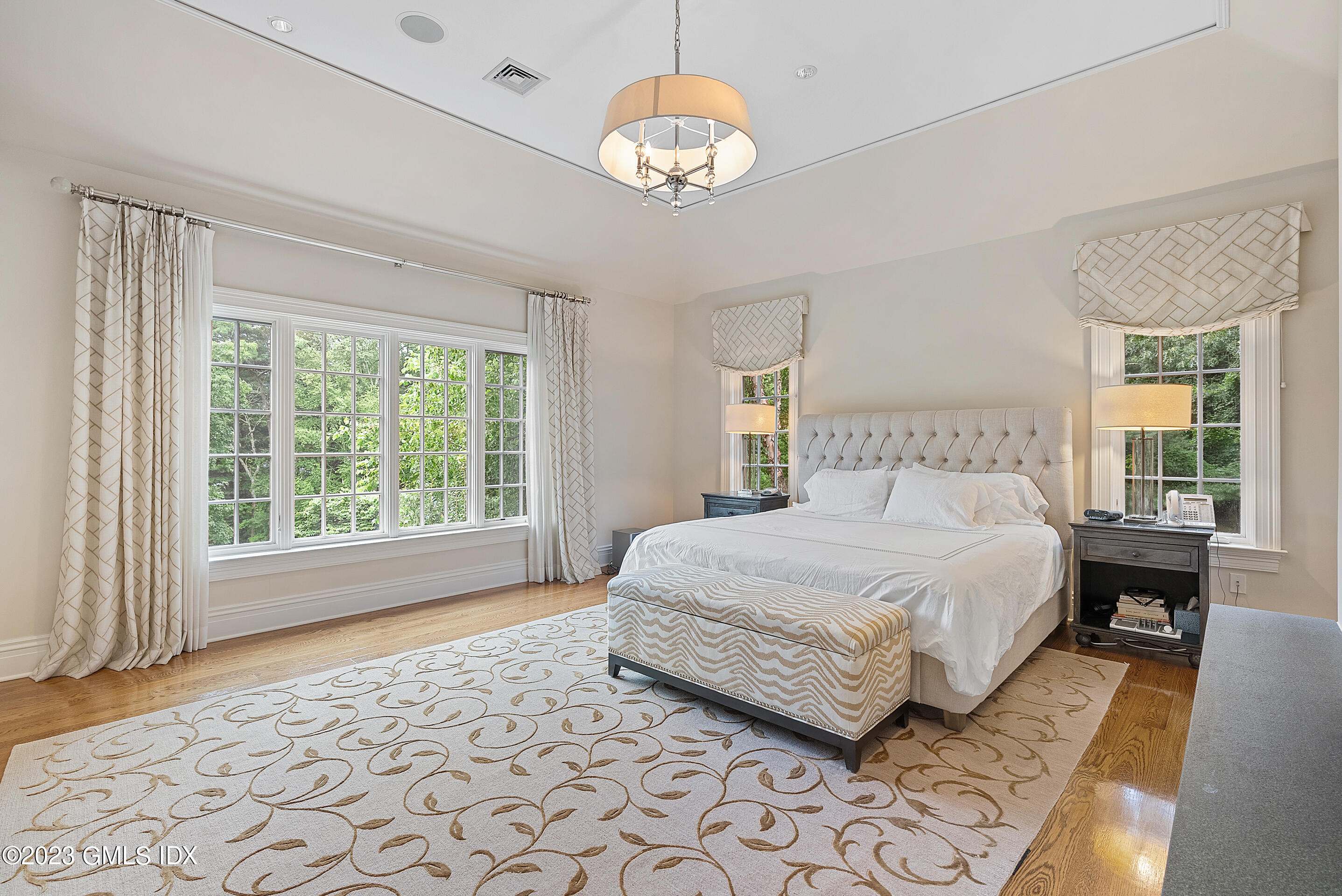 151 Clapboard Ridge Road Greenwich, CT 06831 - Photo 18 of 34 a bedroom with a large bed and a window