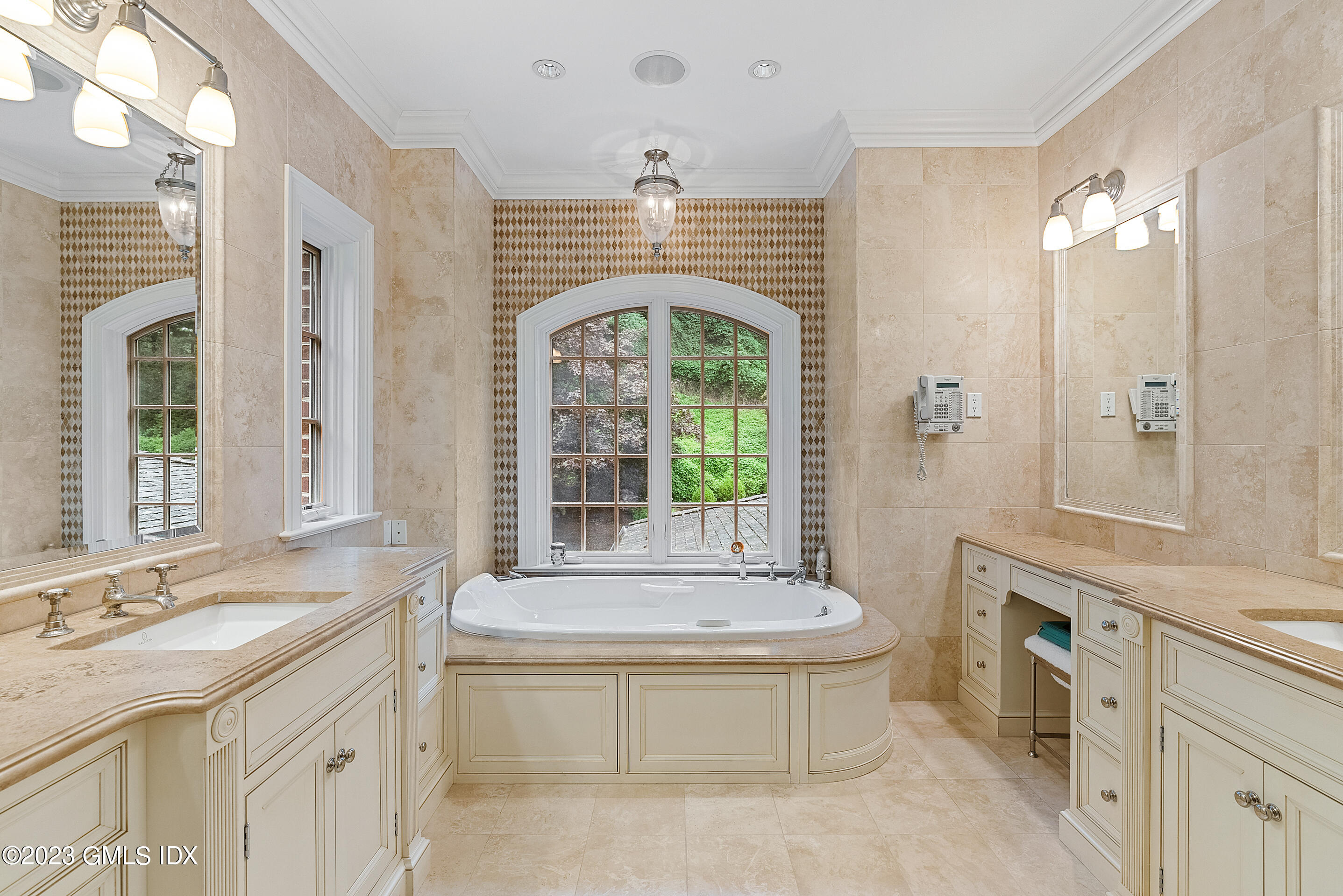 151 Clapboard Ridge Road Greenwich, CT 06831 - Photo 21 of 34 a spacious bathroom with a granite countertop sink mirror and a bathtub