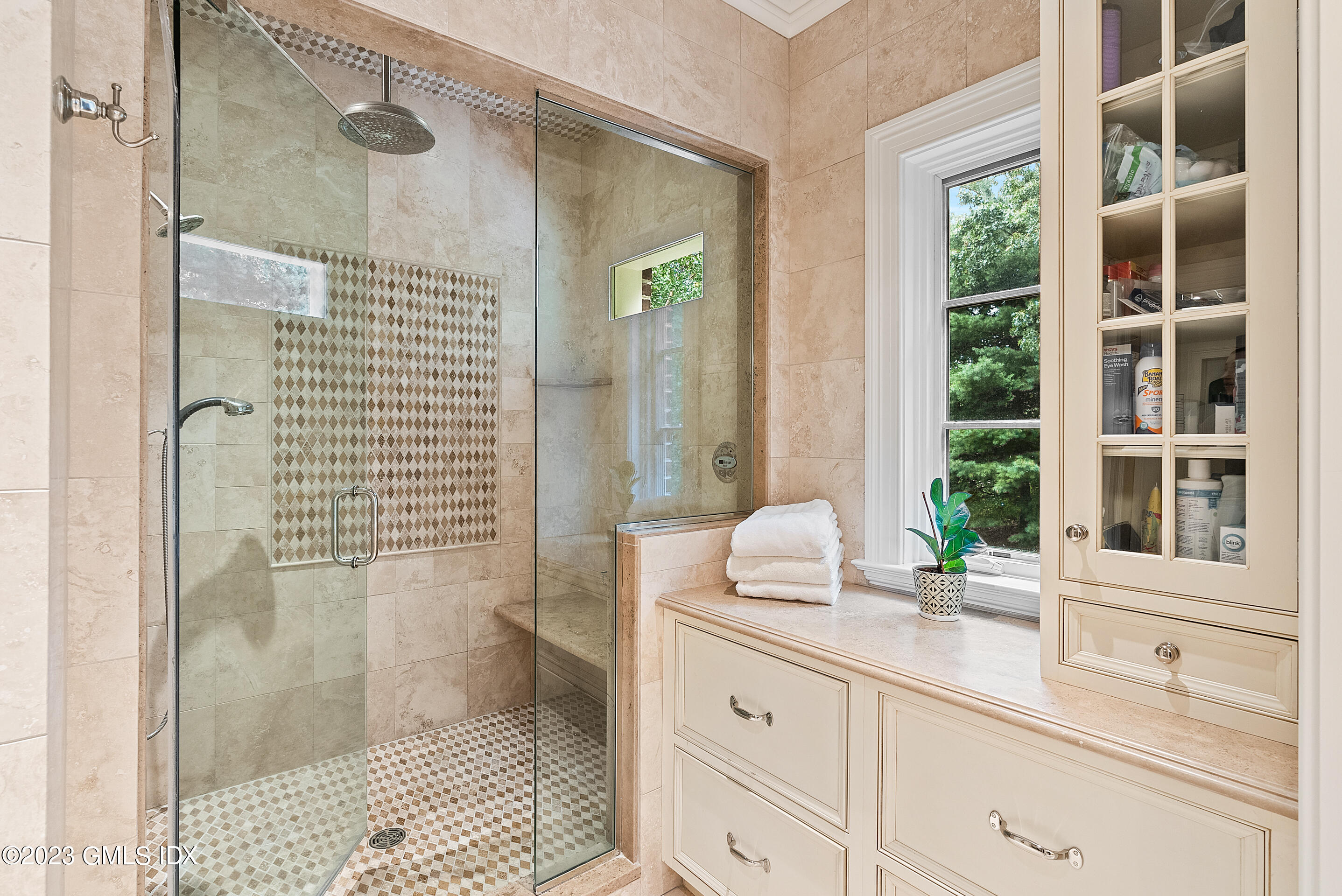 151 Clapboard Ridge Road Greenwich, CT 06831 - Photo 22 of 34 a bathroom with a granite countertop sink a mirror and a shower