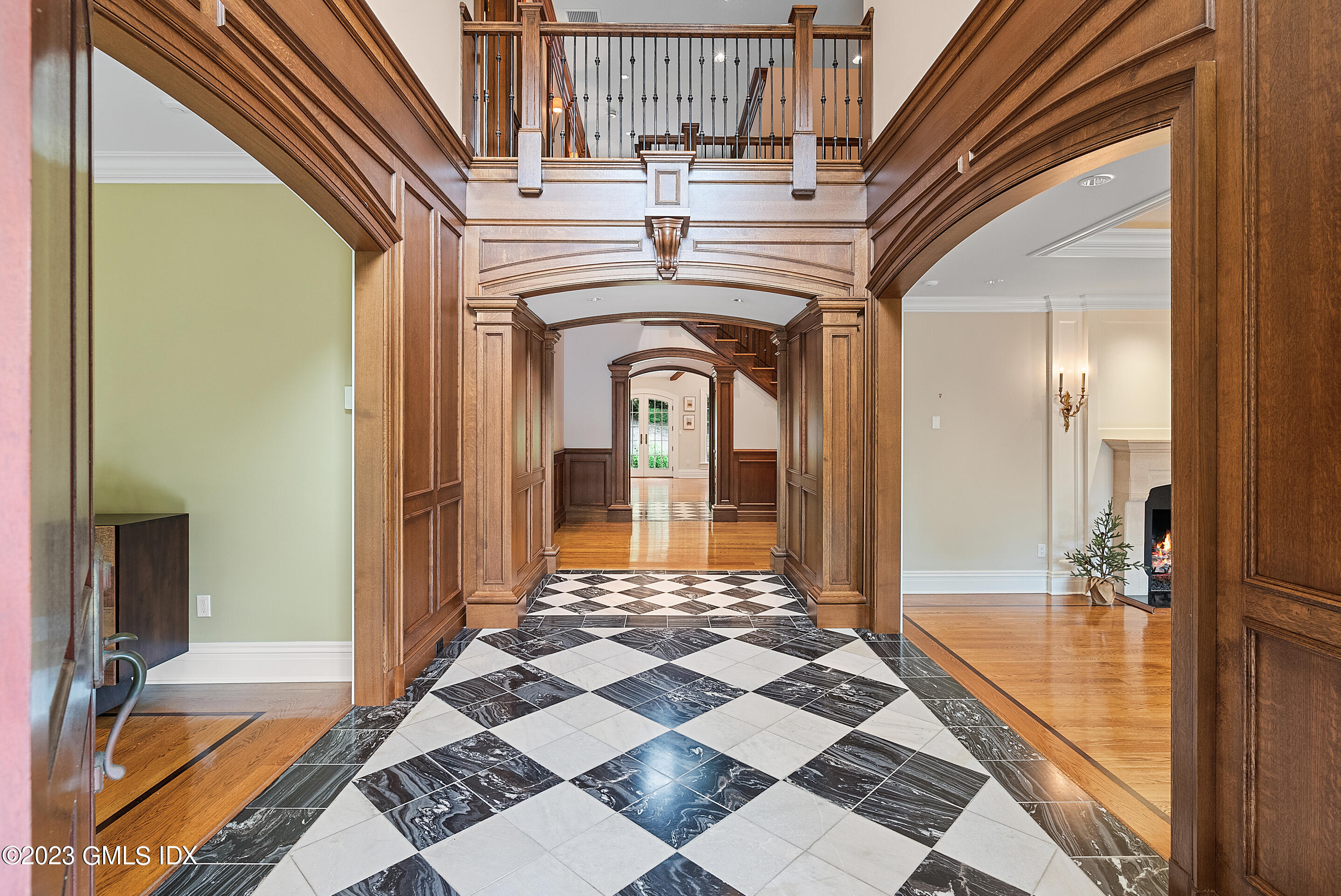 151 Clapboard Ridge Road Greenwich, CT 06831 - Photo 4 of 34 a view of a hallway with wooden floor and a rug