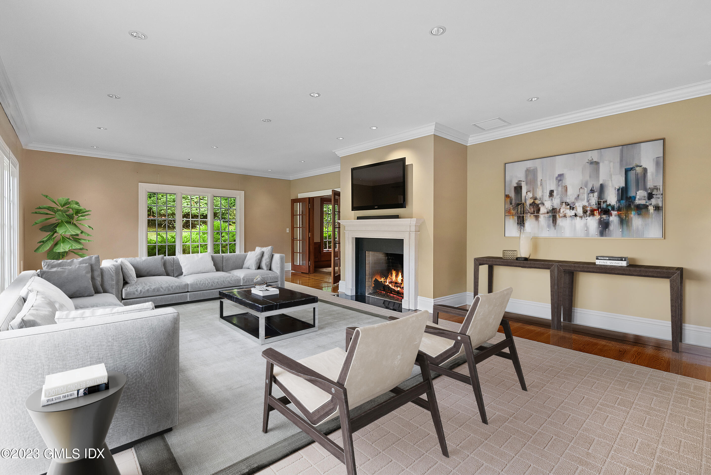 151 Clapboard Ridge Road Greenwich, CT 06831 - Photo 5 of 34 a living room with furniture a fireplace and a flat screen tv