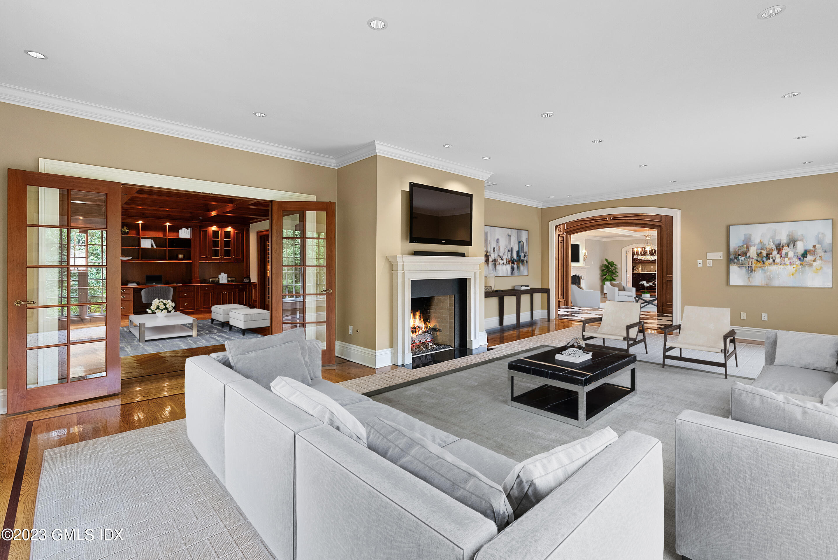 151 Clapboard Ridge Road Greenwich, CT 06831 - Photo 6 of 34 a living room with furniture a flat screen tv and a fireplace